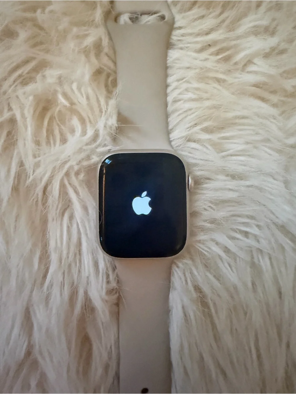 Silver Apple Watch with Light Gray Silicone Band
